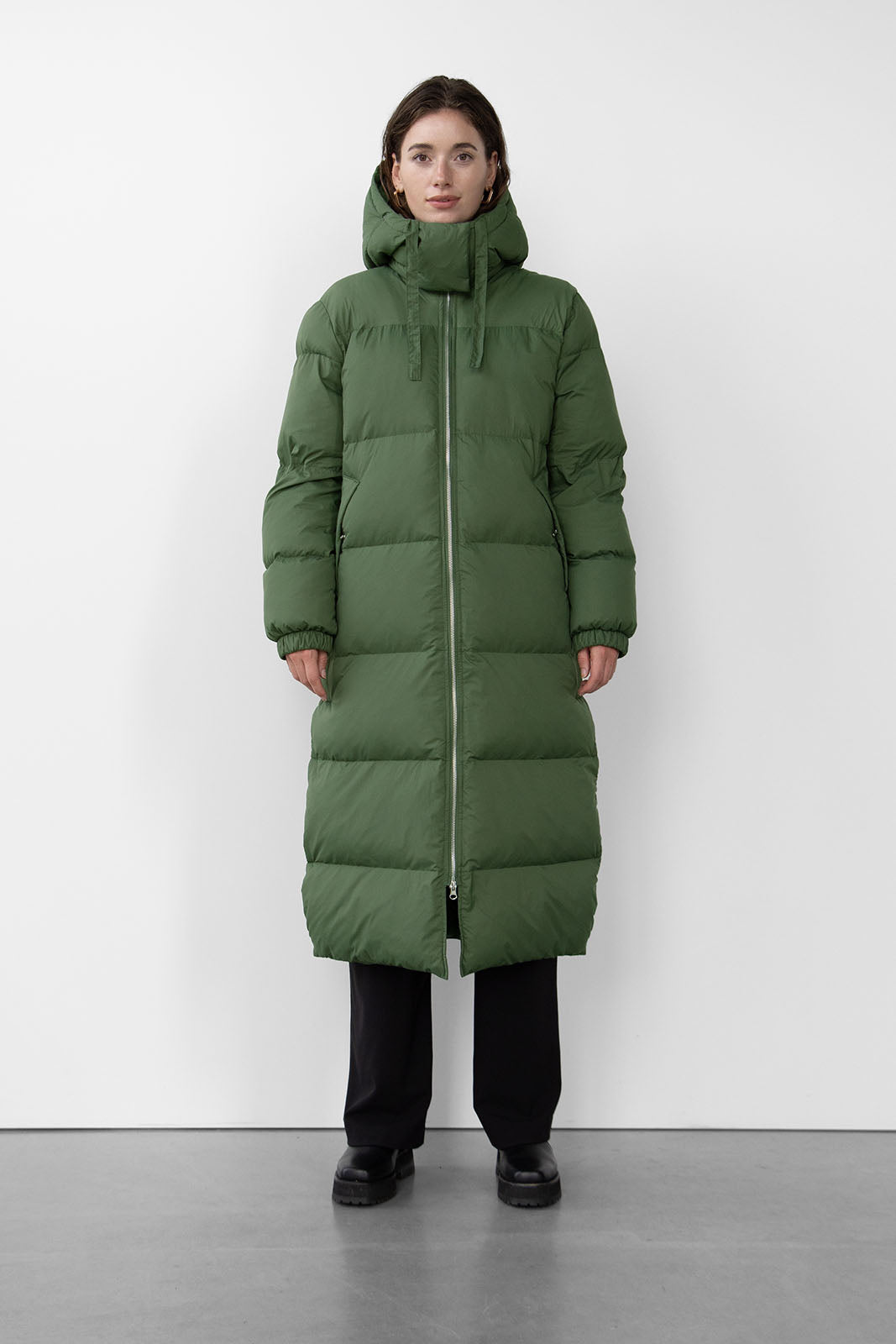 Stay cozy and stylish in this versatile jacket with a detachable adjustable hood, high neck, two-way zip fastening at front, and button detail on the side. Featuring padded side pockets with press studs and an inside zip pocket at chest. Model is 173 cm tall wearing a size small.