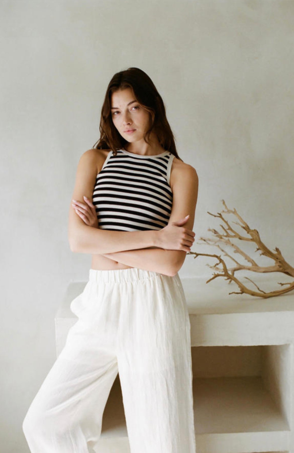 A sleeveless tank top with a striped design, offering a comfortable fit for everyday wear.