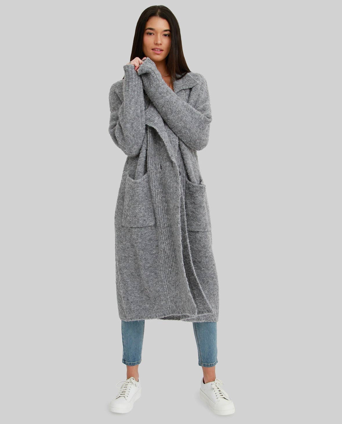 The Born to Run Sweater Coat, a conscious coatigan in a cozy gray knit, blending functionality with fabulous style.