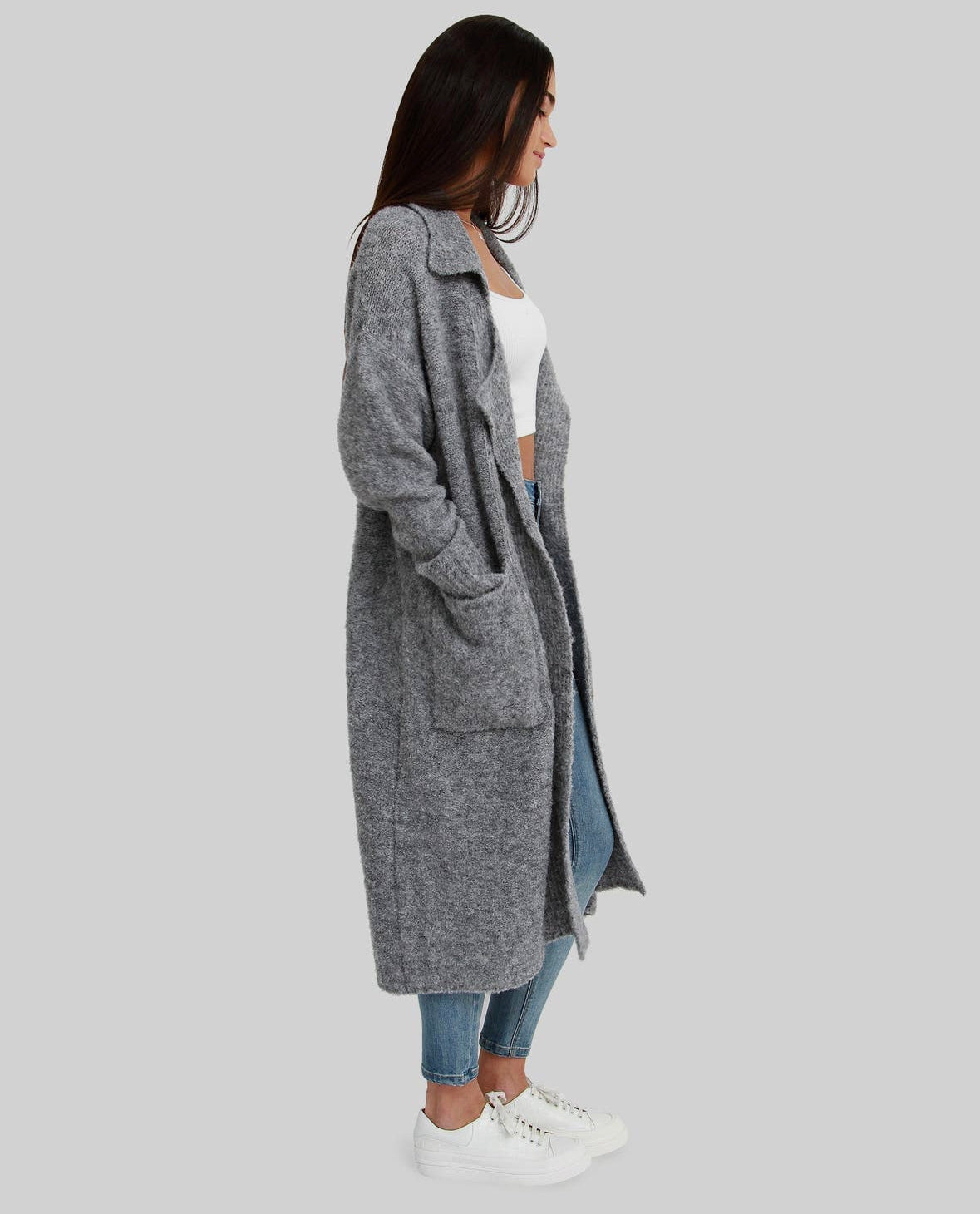 A conscious coatigan in a cozy gray knit, featuring convenient front pockets.