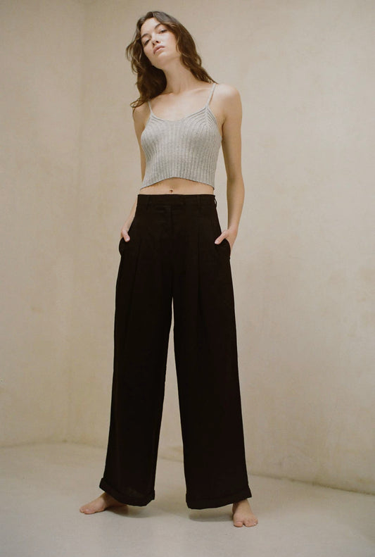 Dune pants featuring a woven thin line design, with pleated wide legs and convenient side pockets for added functionality and style.