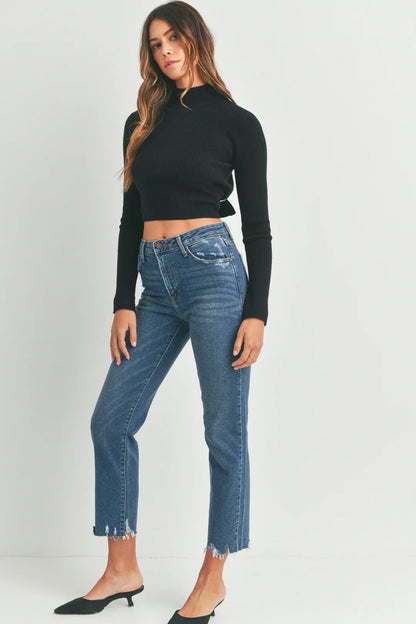 Indigo vintage-washed straight jeans with a distressed hem. These jeans have a rise of 10 inches and an inseam of 27 inches.