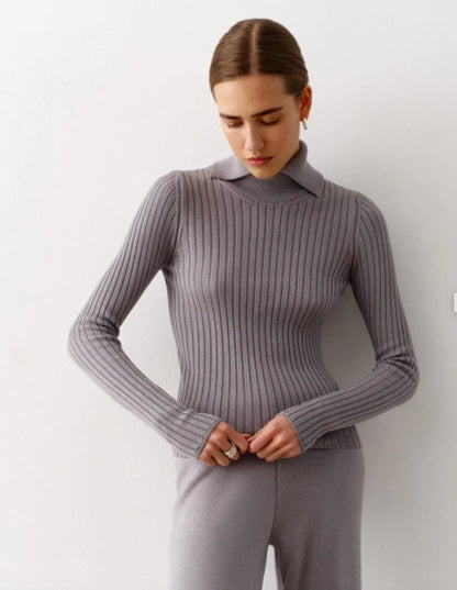 A roll neck sweater knitted in a regular fit, boasting long sleeves and ribbed trims for added comfort and style.