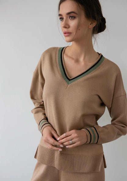 Caramel-colored V-neck sweater featuring colorful cuffs for a pop of vibrancy. The cozy style and easy fit make it a versatile addition to any wardrobe, perfect for chilly days.